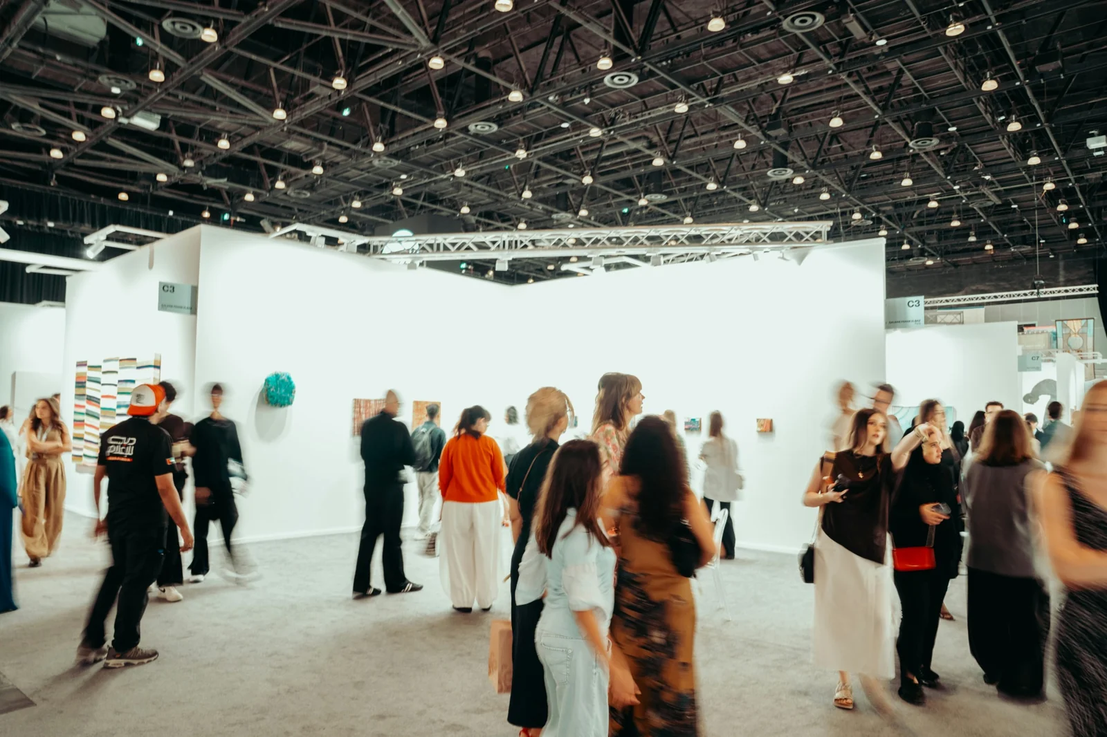 Visitors and exhibitors connecting across an exhibition space